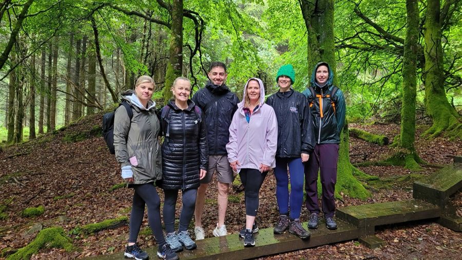 Coach Elan community group on a forest walk
